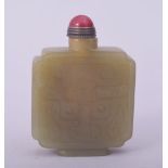 A CHINESE CARVED JADE SNUFF BOTTLE AND STOPPER, 6cm.