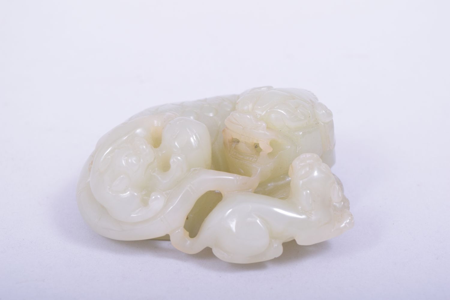 A CHINESE QING DYNASTY CELADON JADE CARVED THREE LIONS, on a fitted hardwood stand, jade 9cm x 8. - Image 2 of 7