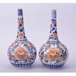 A SMALL PAIR OF IMARI PORCELAIN BOTTLE VASES, each approx. 22cm high.