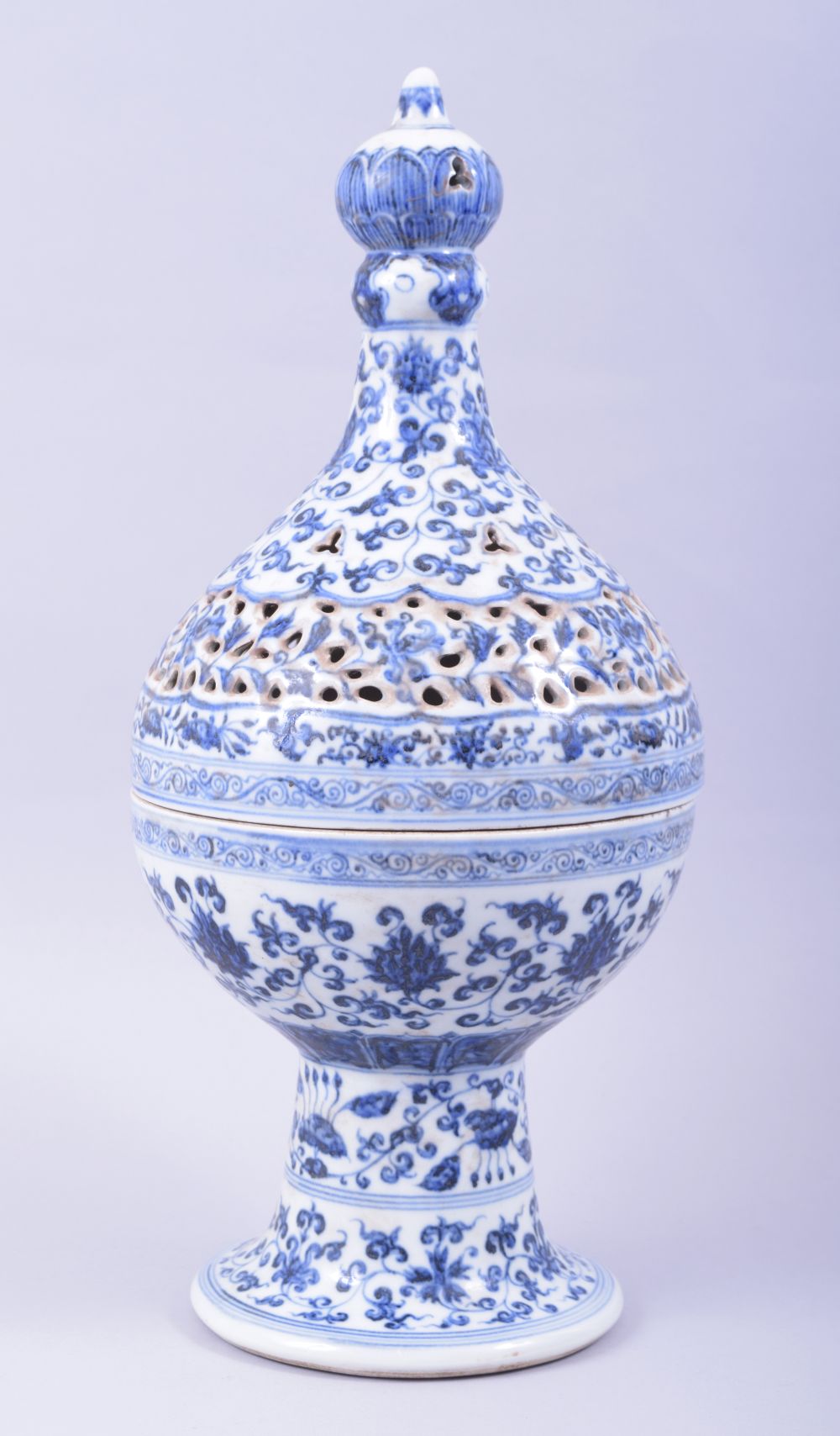 A LARGE CHINESE BLUE AND WHITE PEDESTAL CENSER WITH PIERCED COVER, for the Islamic market, profusely