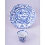 A CHINESE BLUE AND WHITE PORCELAIN DISH, 21cm diameter, together with a blue and white tea cup, (