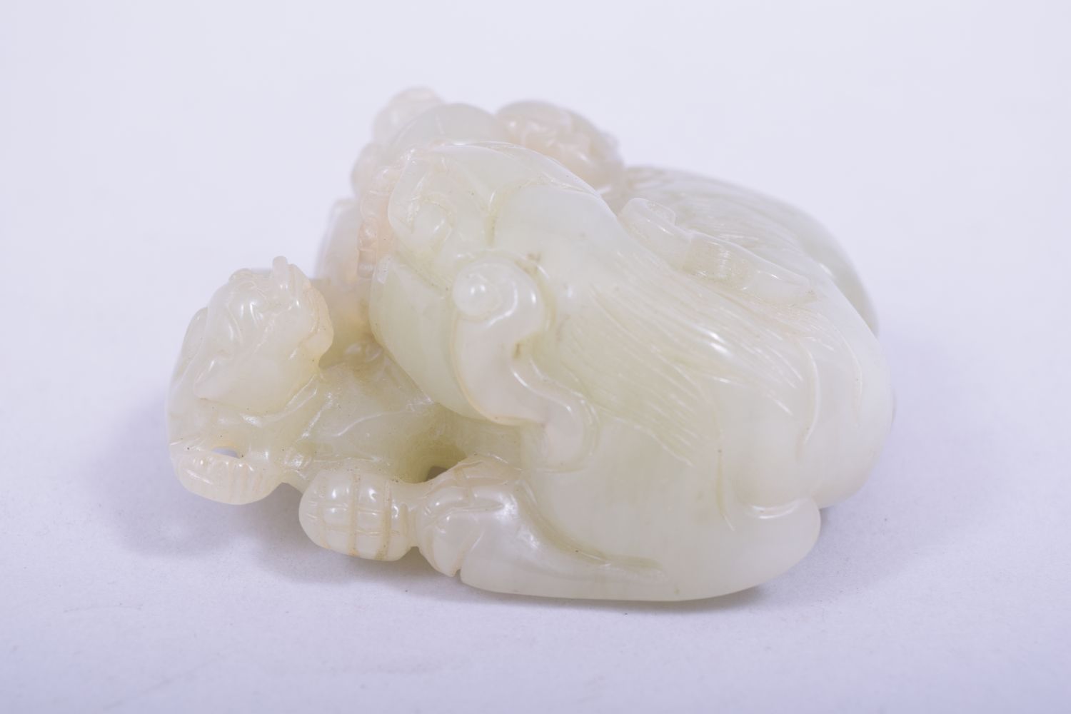 A CHINESE QING DYNASTY CELADON JADE CARVED THREE LIONS, on a fitted hardwood stand, jade 9cm x 8. - Image 3 of 7