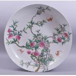 A LARGE CHINESE FAMILLE ROSE PORCELAIN PEACH DISH, painted with peach blossom and bats, with six