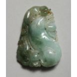 A CHINESE CARVED JADE PENDANT 2ins x 1.25ins.