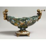 A BOAT SHAPED PORCELAIN COMPORT painted with parrots and flowers with gilt mounts. 11ins long.