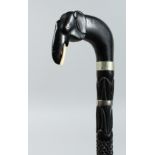 A CEYLONESE EBONY WALKING STICK with elephant handle 31ins long.