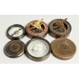 THREE SMALL REPLICA COMPASSES.