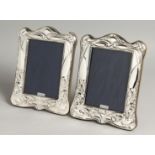 A LARGE PAIR OF SILVER PHOTOGRAPH FRAMES. 19cm x 14cm.