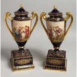 A VERY GOOD PAIR OF 19TH CENTURY VIENNA URN SHAPED VASES, COVERS AND STANDS, rich blue ground