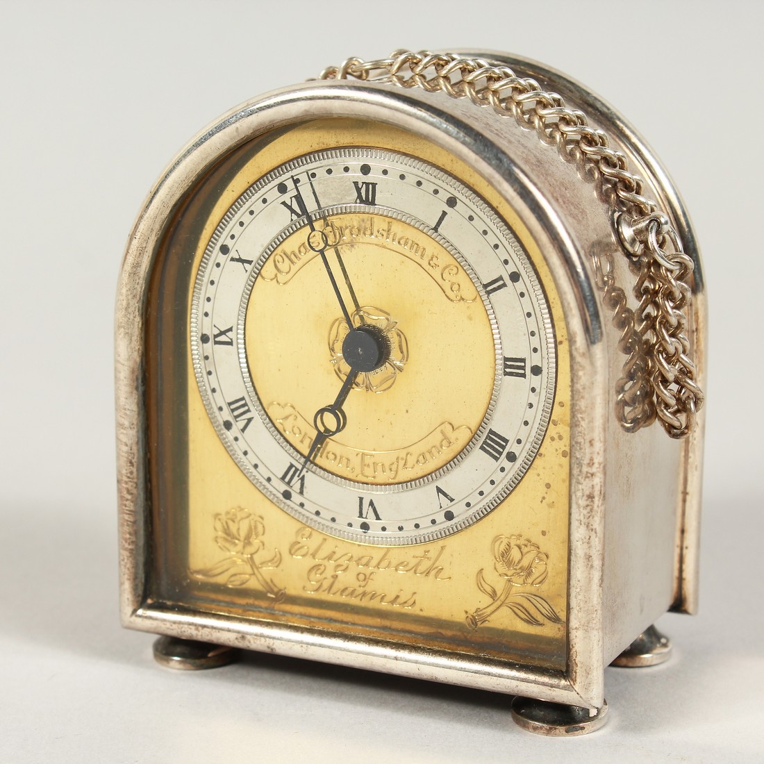 A MINIATURE, CHARLES FRODSHAM AND CO. SILVER, ELIZABETH of GLAMIS DOMED CLOCK with carrying chain on