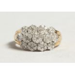 A GOOD GOLD AND DIAMOND CLUSTER RING