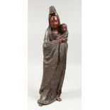 A LARGE BRONZE OF A LADY HOLDING A BABY. 23ins high.