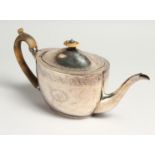 A GEORGE III OVAL TEA POT AND COVER with engraved decoration and initials M C. London 1800, maker