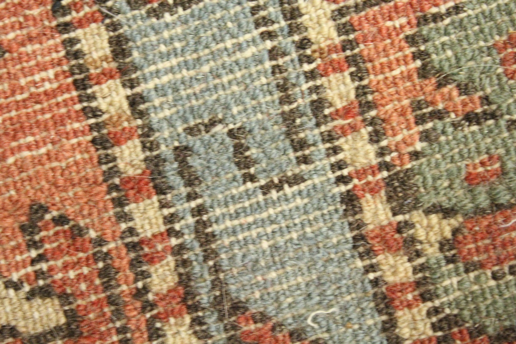 A SMALL PERSIAN RUG, red ground with geometric decoration. 4ft 2ins x 2ft 7ins - Image 4 of 4