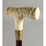 A WALKING STICK with carved bone handle 'Acanthus'. 35ins long.