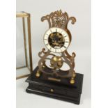 A MOONPHASE BRASS SKELETON CLOCK. 17ins in a glass case.