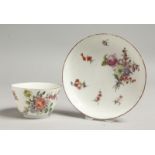 AN 18TH CENTURY CHELSEA RED ANCHOR MARKED TEA BOWL AND SAUCER painted with Meissen style flowers