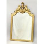 A 19TH CENTURY GILT FRAMED PIER MIRROR, with a shaped top, surmounted with a pair of cherubs holding