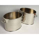 A PAIR OF ALFRED GRATIEN OVAL SILVER-PLATED CHAMPAGNE COOLERS 9ins wide.