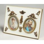 A SUPERB RUSSIAN SILVER AND ENAMEL DOUBLE PHOTOGRAPH FRAME with portrait prints of Alexander II &