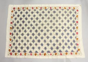 AN ISLAMIC EMBROIDERED TEXTILE, possibly Persian / Susani, cream ground with all over flower head