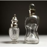 A CUT GLASS SUGAR SIFTER with silver top, Birmingham and a GLASS DECANTER AND STOPPER with a