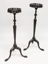 A PAIR OF GEORGE III STYLE MAHOGANY TORCHERES the octagonal tops with pierced galleries on turned