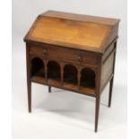 LIBERTY & CO. A SMALL ARTS AND CRAFTS WALNUT BUREAU, the fall front enclosing pigeon holes and a