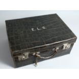 A DREW & CO., LONDON, CROCODILE SUITCASE, initials E. L. C. 17ins long x 12 ins deep x 7ins high.