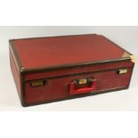 A GOOD LOUIS VUITTON RED LEATHER SUITCASE, 27ins long x 18ins wide x 9ins deep The lock numbered