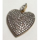 A ROSE DIAMOND HEART SHAPED PENDANT.