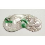 A LARGE TWO-TONE CARVED JADE PENDANT, 12cm long.