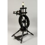 A VERY GOOD 19TH CENTURY SPINNING WHEEL with ivory buttons 29ins high.