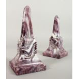 A PAIR OF SLAG GLASS MARBLE OBELISKS. 8ins high.