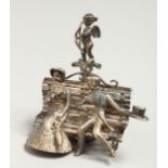 A CAST SILVER GROUP, man and women on a bench. 4cm long.