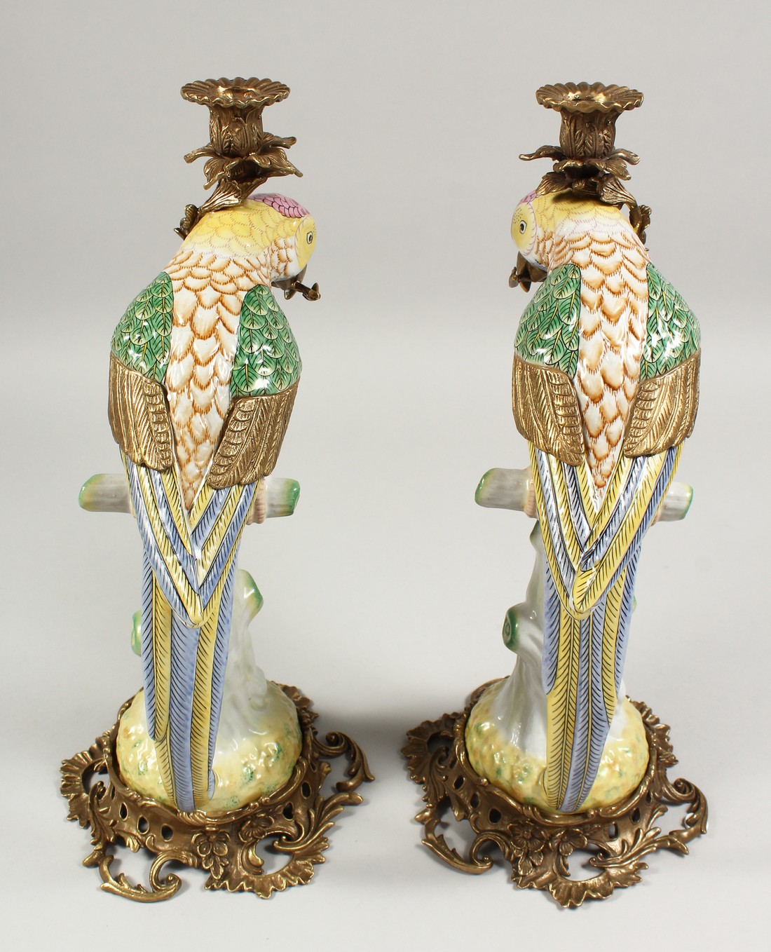 A PAIR OF PORCELAIN PARROT CANDLESTICKS on ormolu bases. - Image 3 of 3