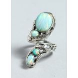 A SILVER AND NATURALISTIC OPAL SET RING.