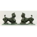 A GOOD PAIR OF BRONZE GRIFFINS on marble bases. 10ins high
