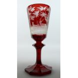 A SUPERB LARGE BOHEMIAN RUBY TINTED TAPERING GOBLET engraved with fruiting vines on an octagonal