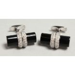 A PAIR OF 18CT WHITE GOLD ONYX AND DIAMOND CUFF LINKS