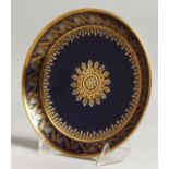 A SEVRES SAUCER SHAPED DISH decorated in platinum and gold on cobalt blue ground, blue printed mark,
