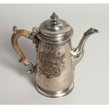 A GEORGE II COFFEE POT AND COVER with a cast spout and wooden handles. 7.25ins high, with an