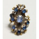 A LARGE 18CT GOLD, SAPPHIRE, AND DIAMOND RING.