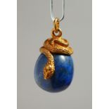 A RUSSIAN SILVER AND LAPIS EGG PENDANT with entwined snake