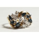 A GOLD SAPPHIRE AND DIAMOND CLUSTER RING