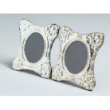 A MINIATURE PAIR OF SILVER PHOTOGRAPH FRAMES.