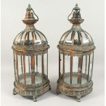 A PAIR OF OCTAGONAL BRONZED METAL LANTERNS 24ins high.