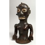 A RARE SKIN COVERED TRIBAL FIGURE with articulated arm.