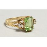 AN EDWARDIAN GOLD PERIDOT AND DIAMOND RING