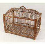 A WOODEN BIRD CAGE with carrying handle 21ins long x 17ins high.